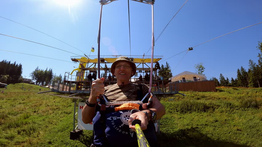 Man films himself on action camera while going down a zipline