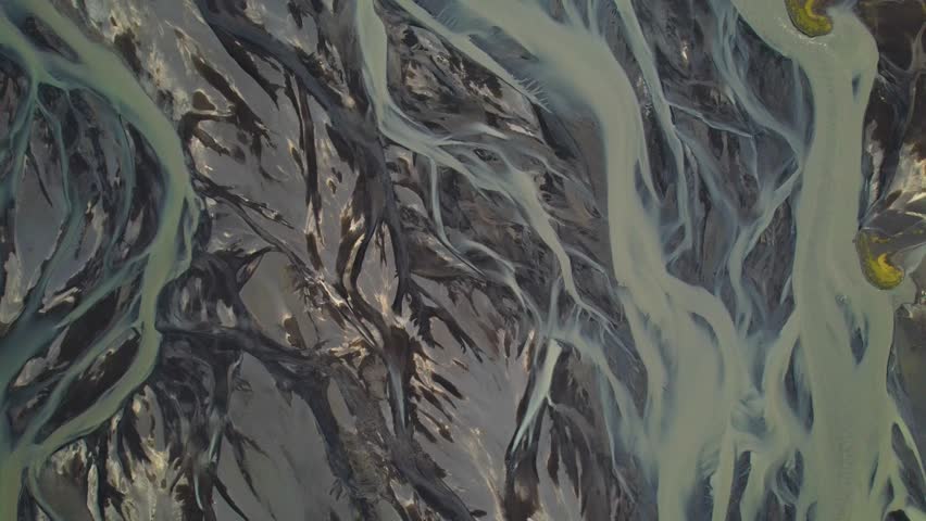 Iceland Glacial River aerial top view. Heimaey island on the background.