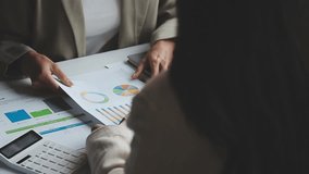 Businesswoman team meeting present, investor colleagues discussing new plan financial graph data with laptop and digital tablet, Finance, accounting, investment - Powered by Shutterstock - Get 15% off with code: PIKWIZARD15