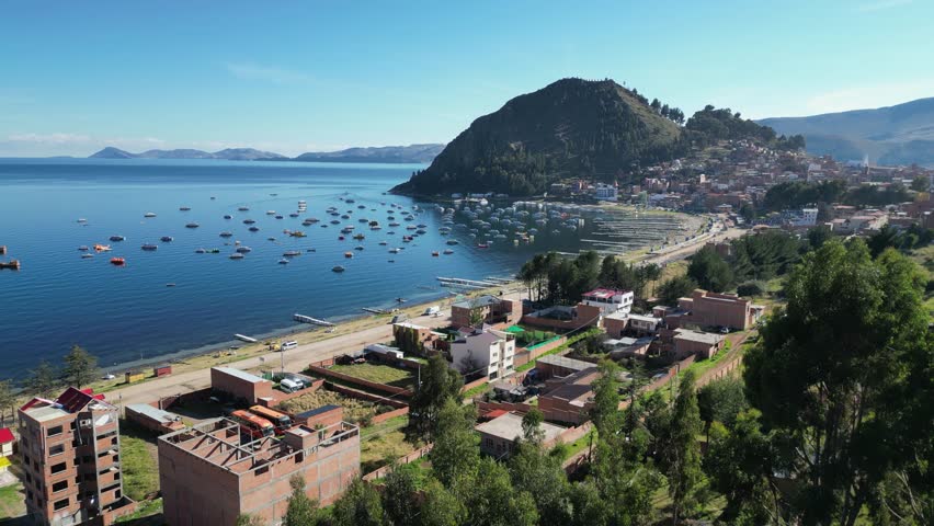 Flyover quiet beachfront homes in Copacabana Bolivia on Lake Titicaca