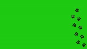 Trail of dog and cat paw prints on Green screen background. Black silhouettes of footprints. Steps tracing the path. Copy space background with dogs and Cats paw. - Powered by Shutterstock - Get 15% off with code: PIKWIZARD15