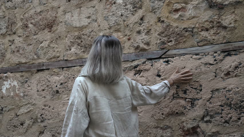 A woman is walking and enjoying the old town of Antalya.