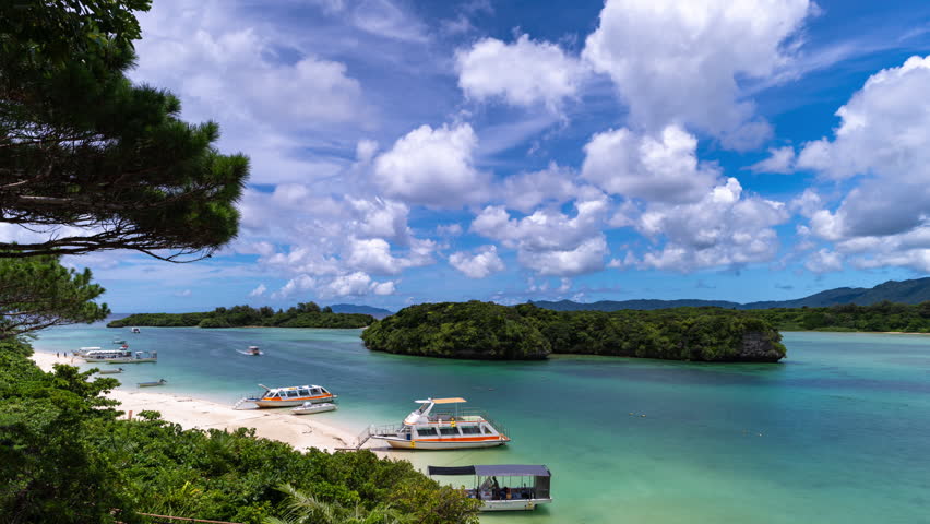 Ishigaki, Okinawa, Japan at beautiful Kabira Bay with tour boats.
