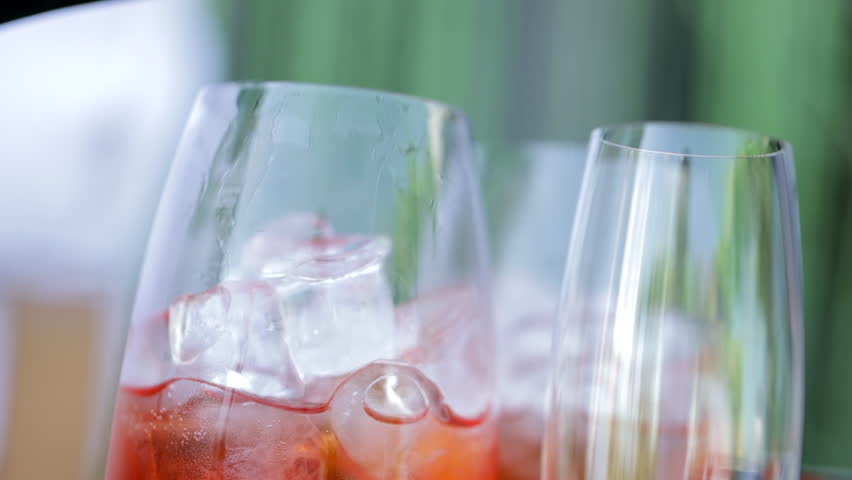 The bartender prepares a cool drink, Aperol