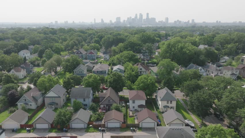 Beautiful skyline in background with suburb houses in foreground of Minnesota, USA.