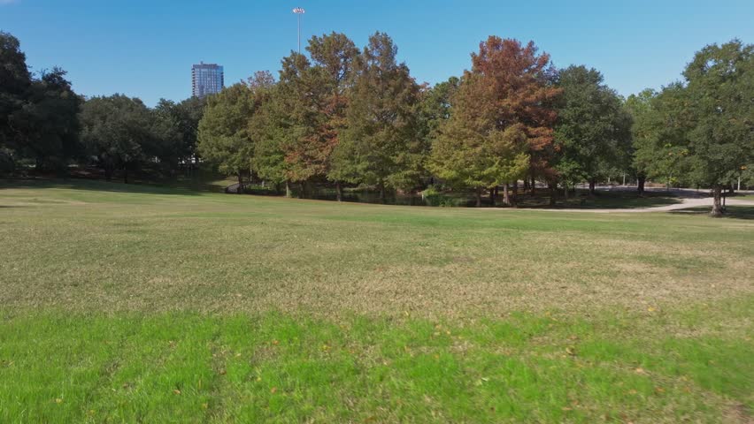 Large grass area inside Sam Houston Park in Houston, TX