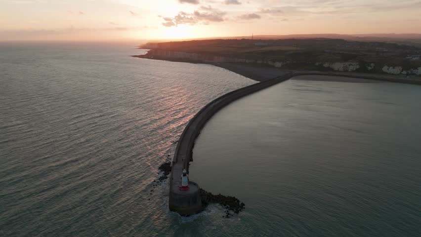 Lighthouse at sunset sunrise, beautiful sea coastline English channel, Newhaven