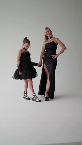 Mother and daughter in photo studio. Concept of photo shoot in studio.