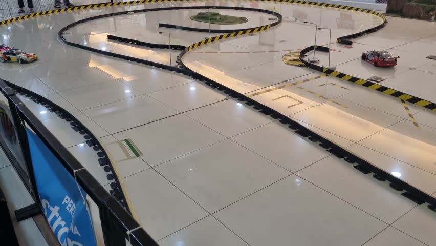 Jakarta, 2 June 2024-a radio controlled drift car which runs on a white floor
