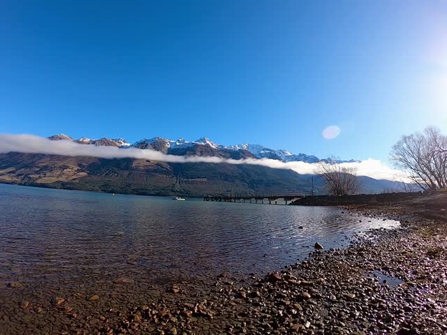 Beautiful landscape views at Glenorchy marina with mountain ranges at the background 