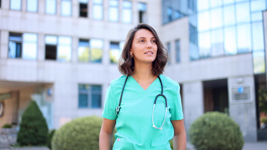 Young female doctor taking a break outdoors