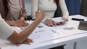 Financial strategy discussion in office meeting. Colleagues analyze charts and graphs financial data, discuss strategies, and collaborate in an office setting. Professional teamwork. - Powered by Shutterstock - Get 15% off with code: PIKWIZARD15