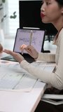 Financial analysis collaboration by business team with digital graph and chart. Business team discussing financial data analysis with graph and chart on a tablet. - Powered by Shutterstock - Get 15% off with code: PIKWIZARD15