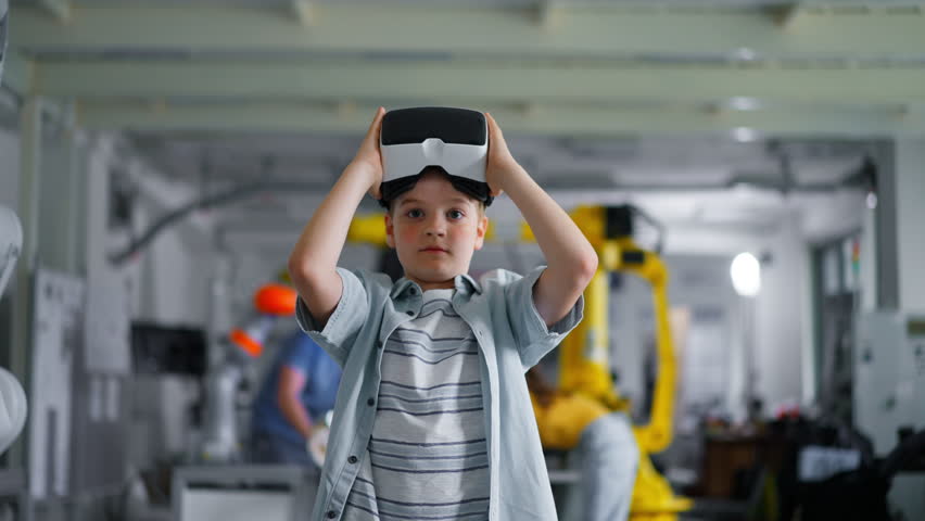 Video of schoolboy with VR headset on head. Children learning robotics in Elementary school, using modern technology, virtual reality. - Powered by Shutterstock - Get 15% off with code: PIKWIZARD15