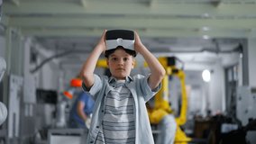 Video of schoolboy with VR headset on head. Children learning robotics in Elementary school, using modern technology, virtual reality. - Powered by Shutterstock - Get 15% off with code: PIKWIZARD15