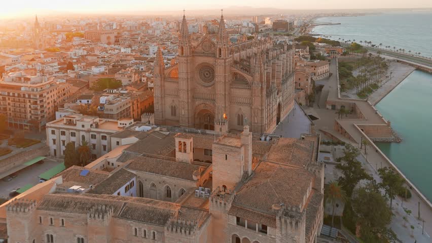 The Cathedral of Santa Maria of Palm, Palma de Mallorca, Mallorca, Balearic Islands, Spain. Aerial view of the Historic Cathedral in Majorca at sunrise. 