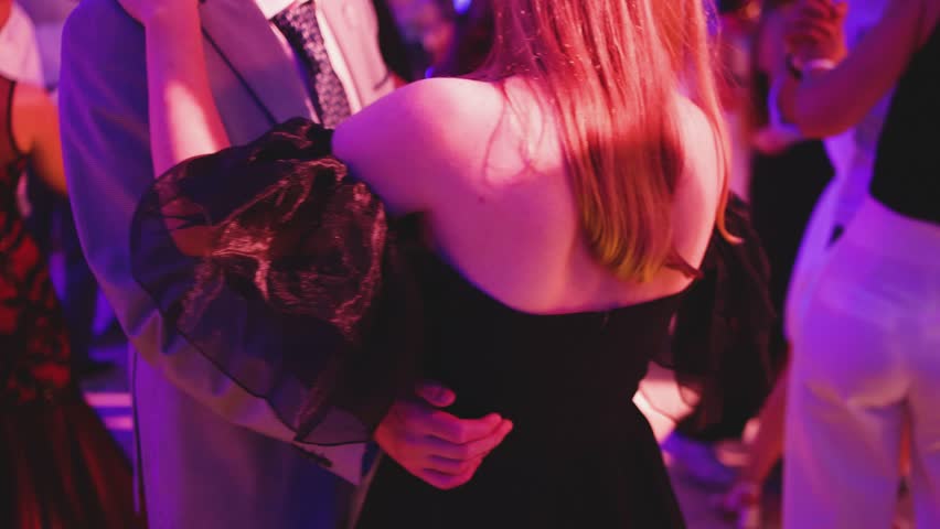 High school graduates dancing on prom, waltz and classical ball dance in dresses and suits on school graduation party, girls and boys classical ballroom dancers, couples dance quadrille and polonaise