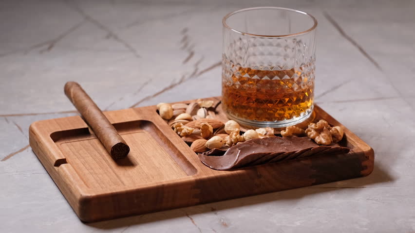 whiskey and cigar presentation, with some appetizers and nuts, fa01