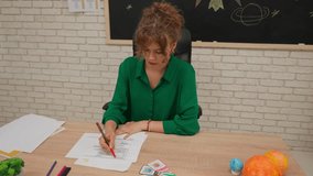 Junior school boys and girls sit in room in astronomy class. Female teacher reads test papers, kids bored and napping. Modern education concept. - Powered by Shutterstock - Get 15% off with code: PIKWIZARD15