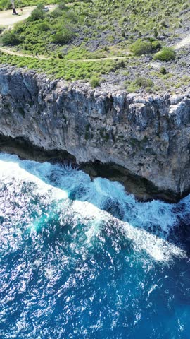 The Bluff rocky stone structure hill in Cayman Brac sister island of Grand Cayman from the Cayman Islands British Oversea territory in the West Indies surrounded by the Caribbean sea turquoise water