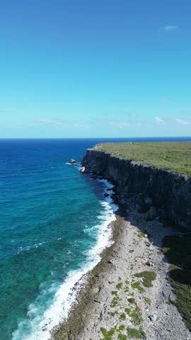 The Bluff rocky stone structure hill in Cayman Brac sister island of Grand Cayman from the Cayman Islands British Oversea territory in the West Indies surrounded by the Caribbean sea turquoise water