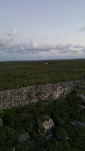 The Bluff rocky stone structure hill in Cayman Brac sister island of Grand Cayman from the Cayman Islands British Oversea territory in the West Indies surrounded by the Caribbean sea turquoise water