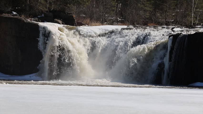 Spring melt flowing over Middle Falls.  Middle Falls divides Canada and the United States by Pigeon River border crossing.