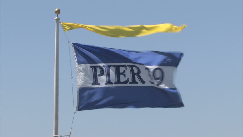 SAN FRANCISCO, CA - JUNE 02: Pier 39 flag blowing in the wind at Fisherman's