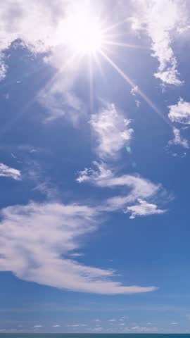 4K vertical footage Time lapse of blue sky and clouds in summer season,Good weather day clouds sky background,Clouds over sea timelapse