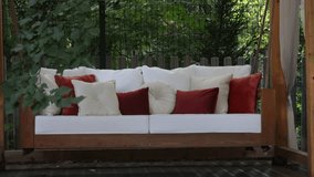 veranda with garden swing is decorated with fall decor and chrysanthemums - Powered by Shutterstock - Get 15% off with code: PIKWIZARD15