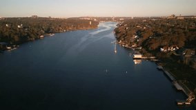 Aerial view Rowing Practice at Sunrise in Nova Scotia Canada, Halifax. Drone captures the early morning training session of a young rowing team, paddling in unison across a peaceful bay in Nova Scotia - Powered by Shutterstock - Get 15% off with code: PIKWIZARD15