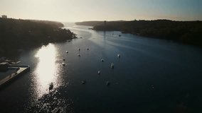 Aerial view Sunrise Rowing Team in Halifax Ocean Bay, Canada. Drone footage shows a sports canoe team rowing in unison in the peaceful waters of Halifax's ocean bay at sunrise. - Powered by Shutterstock - Get 15% off with code: PIKWIZARD15