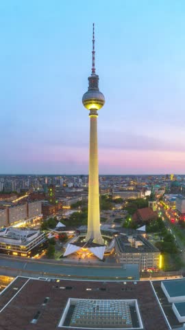 Berlin Germany time lapse day to night city skyline at alexanderplatz and TV Tower (Vertical)