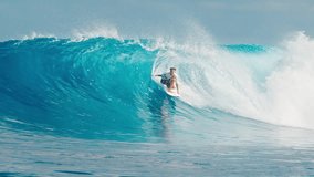 Experienced young male surfer rides huge ocean wave at the famous Sultans surf spot on the North Atolls in the Maldives and gets barrelled - Powered by Shutterstock - Get 15% off with code: PIKWIZARD15