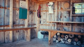 The Interior of a Wooden Cabin, Featuring Chopped Logs and a Worn Wooden Couch, Along the Route From Seterdjupna to Malitjønna in Indre Fosen, Trøndelag, Norway - Handheld Shot - Powered by Shutterstock - Get 15% off with code: PIKWIZARD15