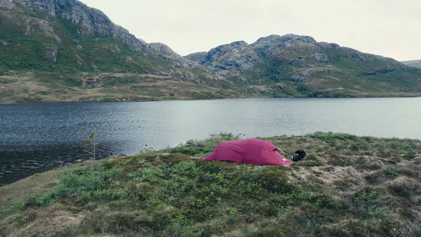 A Red Camping Tent was Pitched on the Shore of Pålvatnet in Åfjord, Trøndelag County, Norway - Orbit Drone Shot