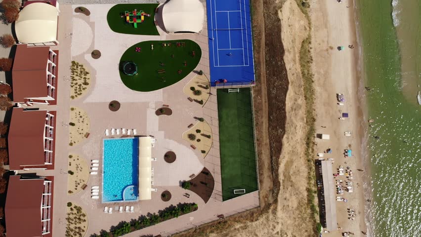 Odessa region, Ukraine, 30 of August, 2021. Aerial drone view from above view of Players play tennis on a tennis court in hotel on high cliff. Odessa region, Zatoka, Gribovka, Gribivka, Ukraine.
