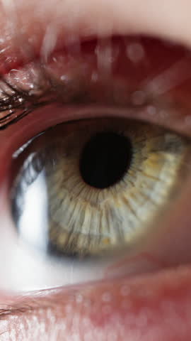 Close-up shot of an eye showcasing gray flecks in the iris, capturing the unique details that add depth and character to the eye