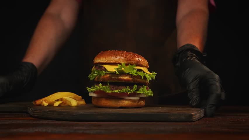 Burger with french fries serving in restaurant.