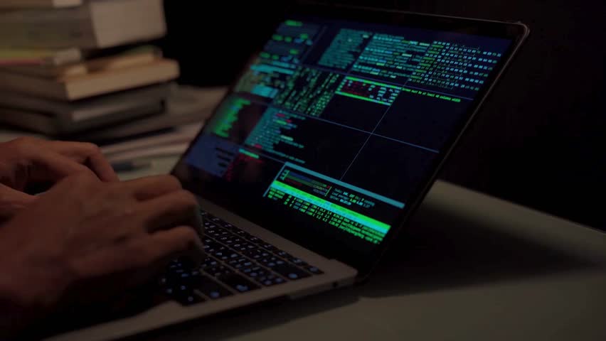 Extreme close-up human hands. Side view. Cyber security close-up Coder programmer interact with chat bot, Programmer writes code in office at Night