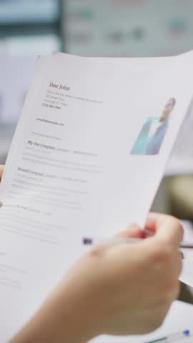 Vertical Video HR employers analyzing candidate CV after the job interview, carefully evaluating all qualifications and business administration knowledge or experience. Selection process for