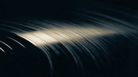Vinyl record turning and playing seamlessly. Gramophone vinyl plate, low-angle view in close up - Powered by Shutterstock - Get 15% off with code: PIKWIZARD15