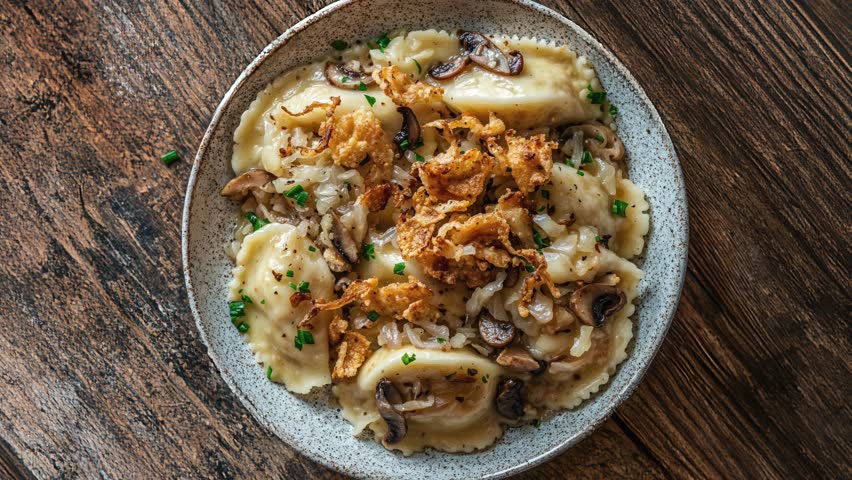 Delicious Pierogi with Crispy Onions and Mushrooms on Wooden Table