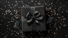Elegant Black Gift Box With Ribbon And Confetti Decoration - Powered by Shutterstock - Get 15% off with code: PIKWIZARD15