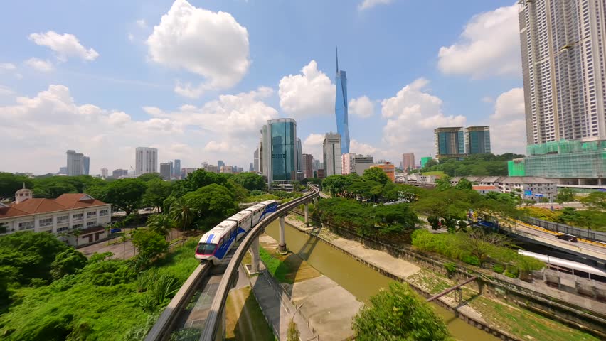 Cinematic FPV flight over skytrain in downtown Kuala Lumpur, Malaysia