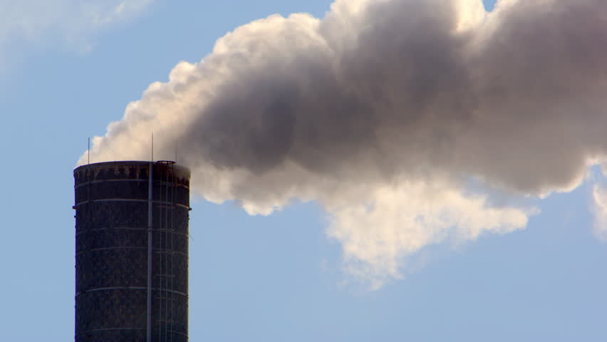 Choking plumes of factory smoke carbon emissions released into atmosphere