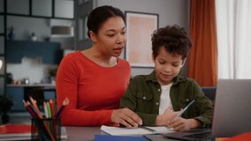 African American family caring mother mom mommy woman babysitter female helping teaching little boy help with laptop computer online course class lesson child kid son studying learning homework home - Powered by Shutterstock - Get 15% off with code: PIKWIZARD15