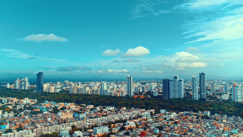 Aerial view of the amazing city of Santo Domingo. The capital of the Dominican Republic. Urban landscape. Skyscrapers and park. Old town. Real view from above on the capital background.