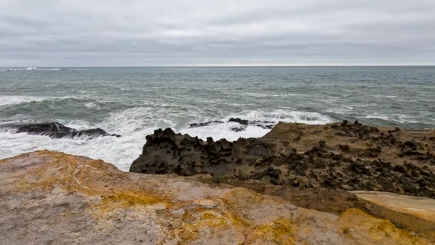 Slow Motion Pacific Ocean crashes into rock coral coast
