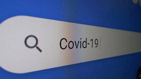 Covid-19 typing text search bar, extreme close-up - Powered by Shutterstock - Get 15% off with code: PIKWIZARD15